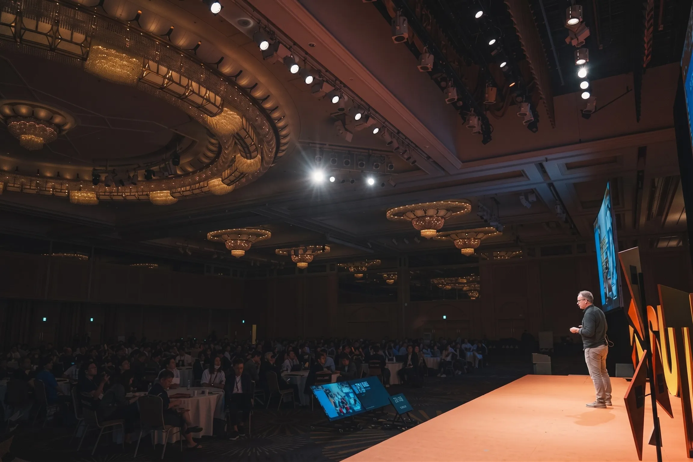 A speaker on stage at the Sponsored Intelligence Summit